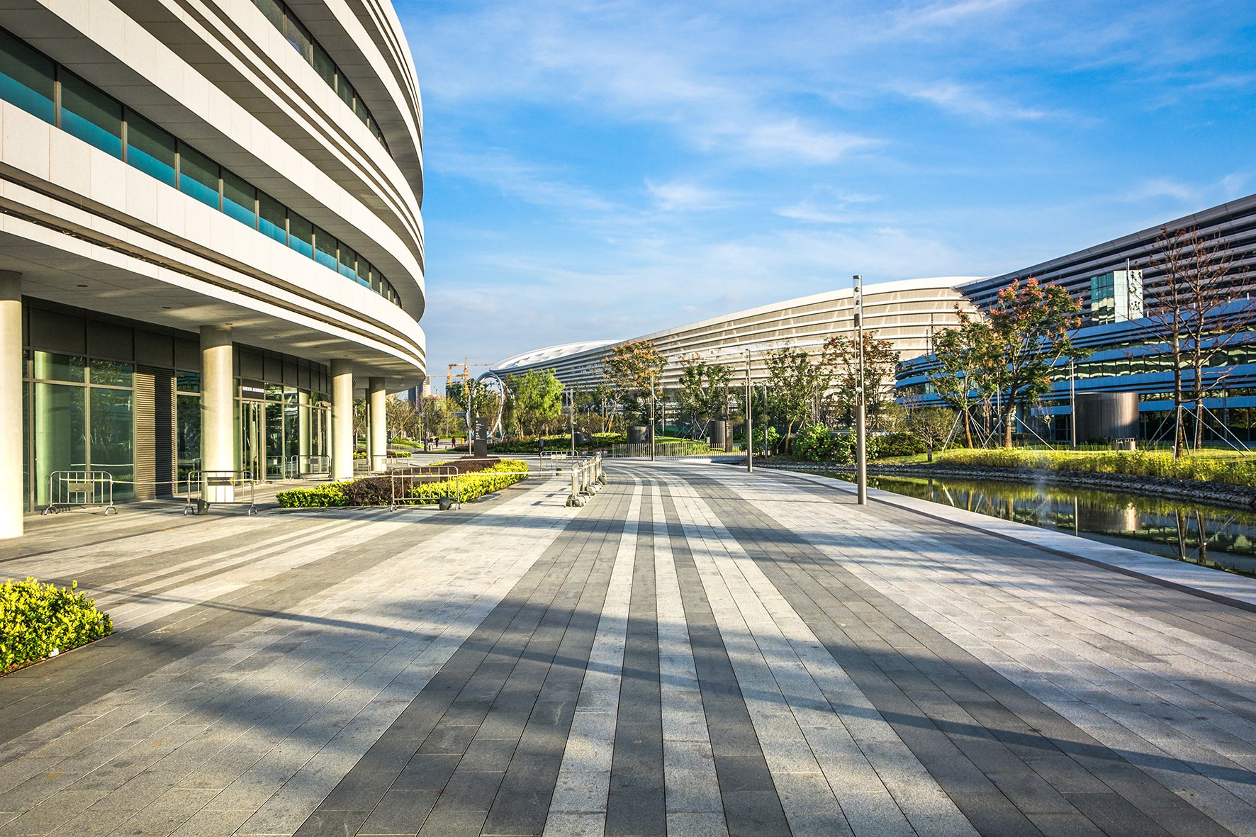 Building with street and trees and a blue sky