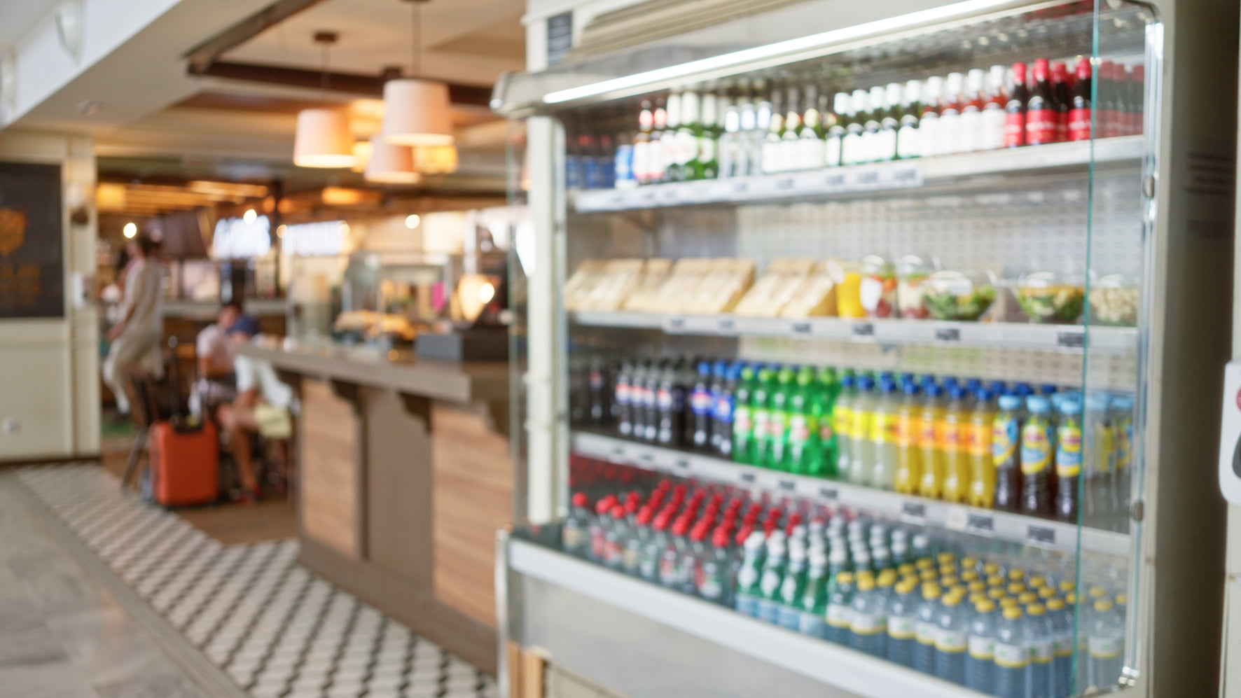 Fridge stocked with drinks in a store setting