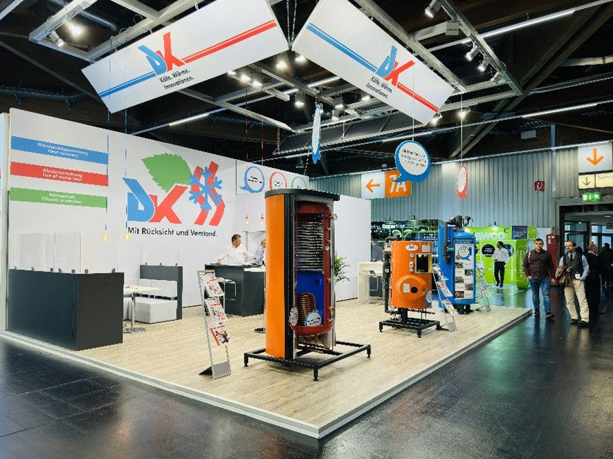 DK booth at a trade show with various products and branding.