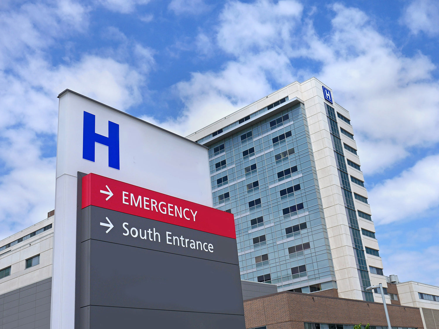 Hospital entrance with buildings behind.