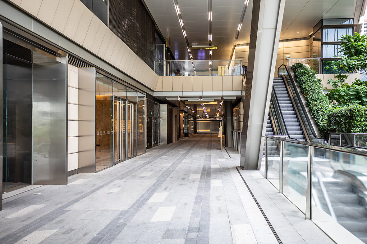 Lobby with lifts and esculators within a mixed use building.